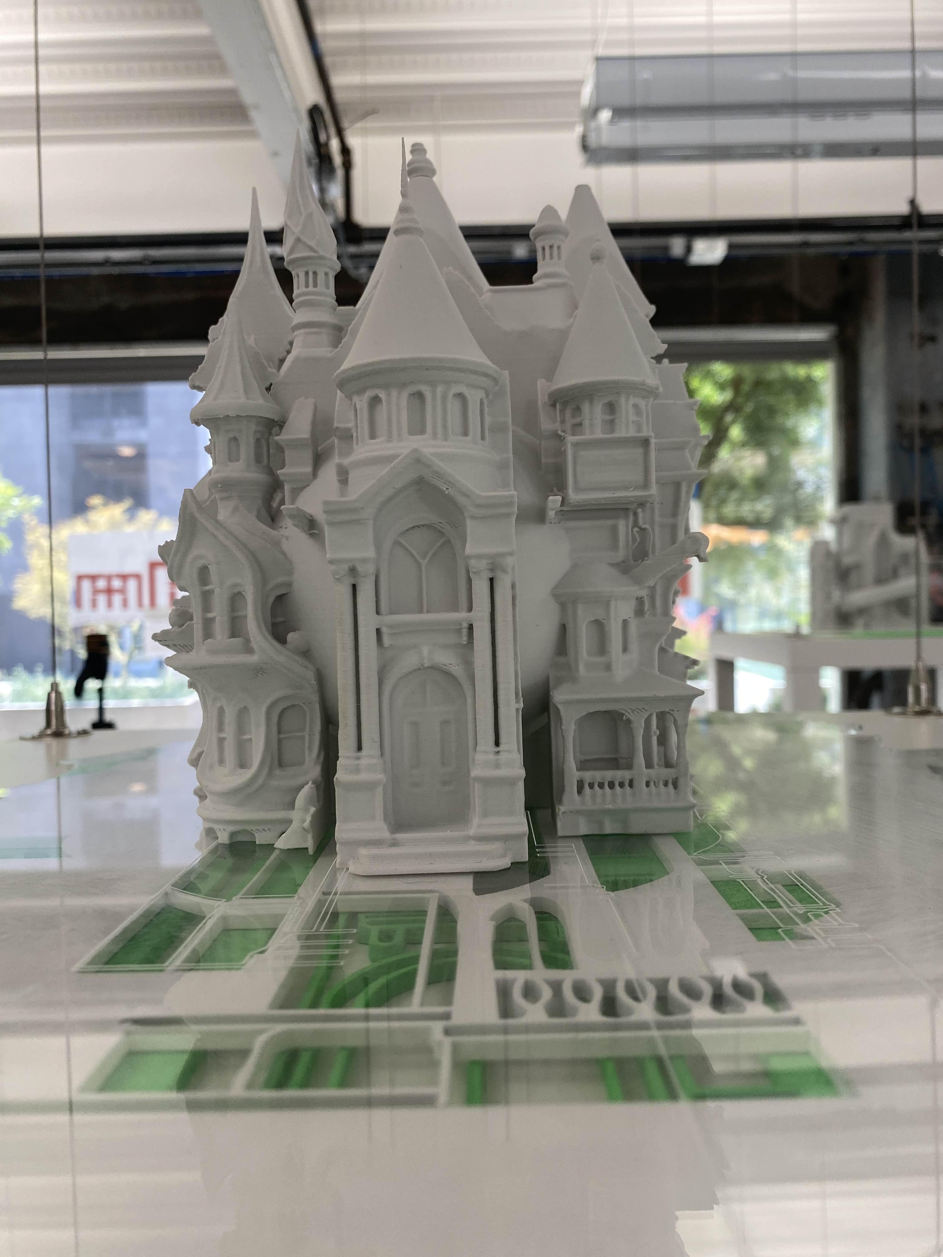 White 3D print on green base